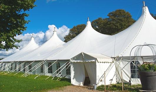 a group of luxury portable restrooms with individual stalls and running water in Sherborn, MA